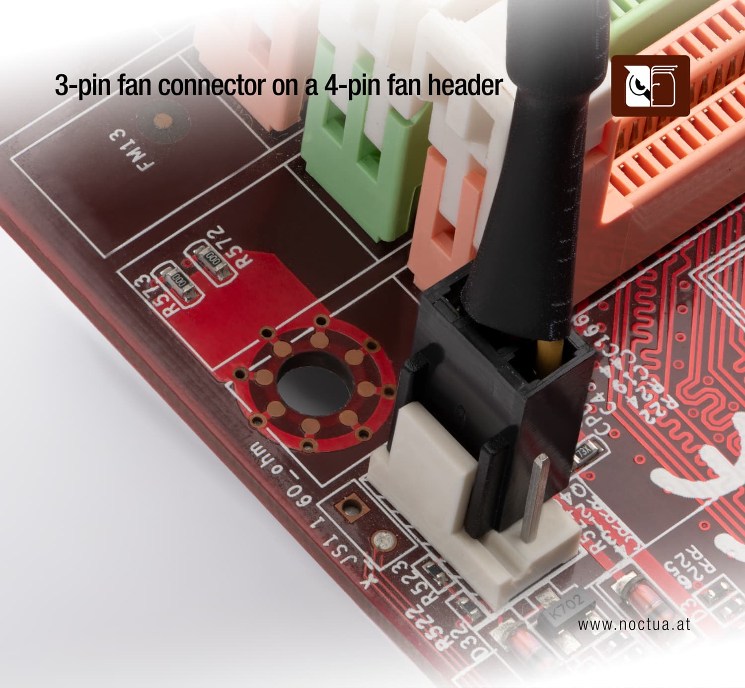 A 3-pin fan connector plugged into a 4-pin CPU fan header on a motherboard, showing that the connector fits while leaving one pin unused.