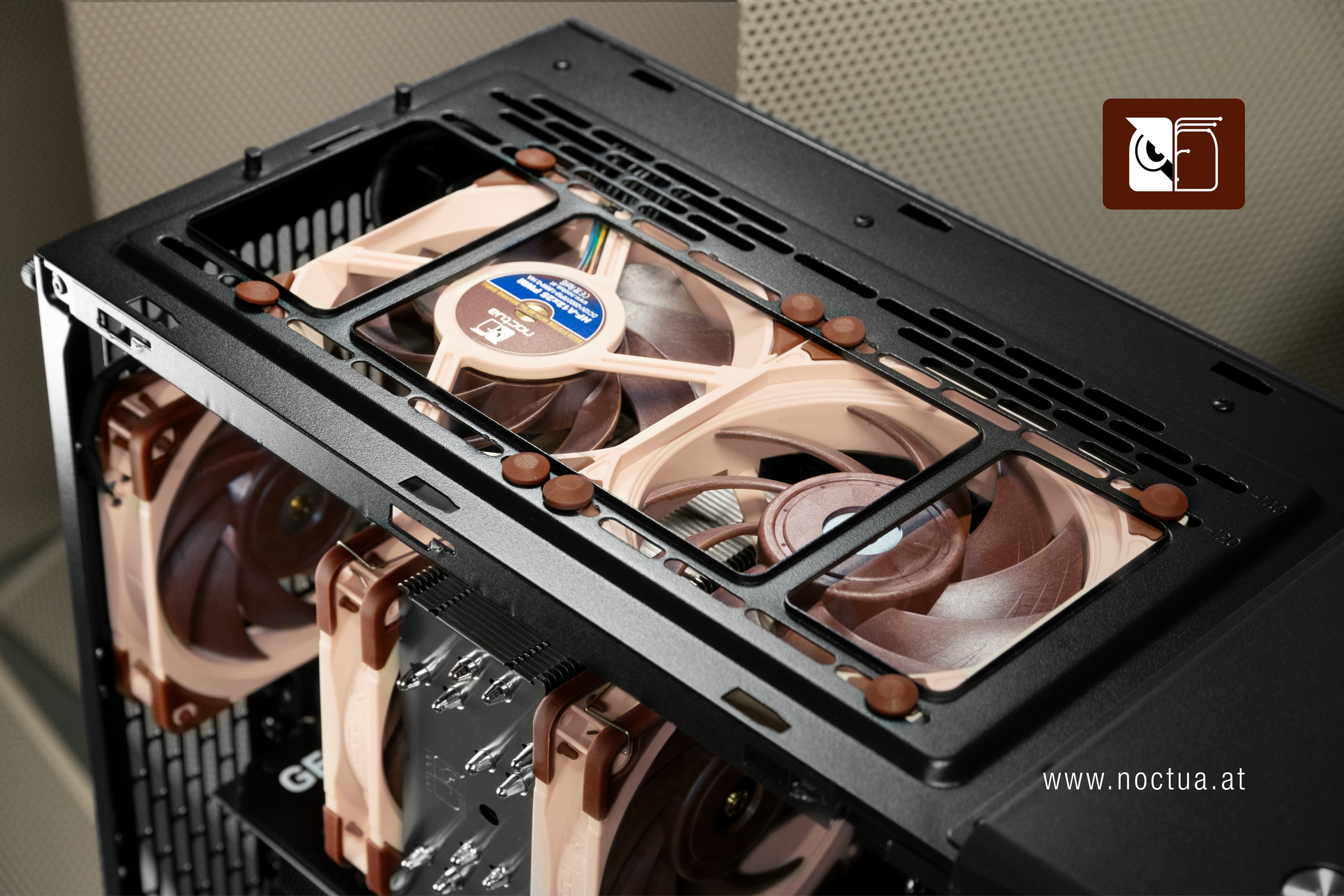 Top-down view inside a Fractal North PC case, showing two Noctua fans mounted at the top one as exhaust and one as intake.