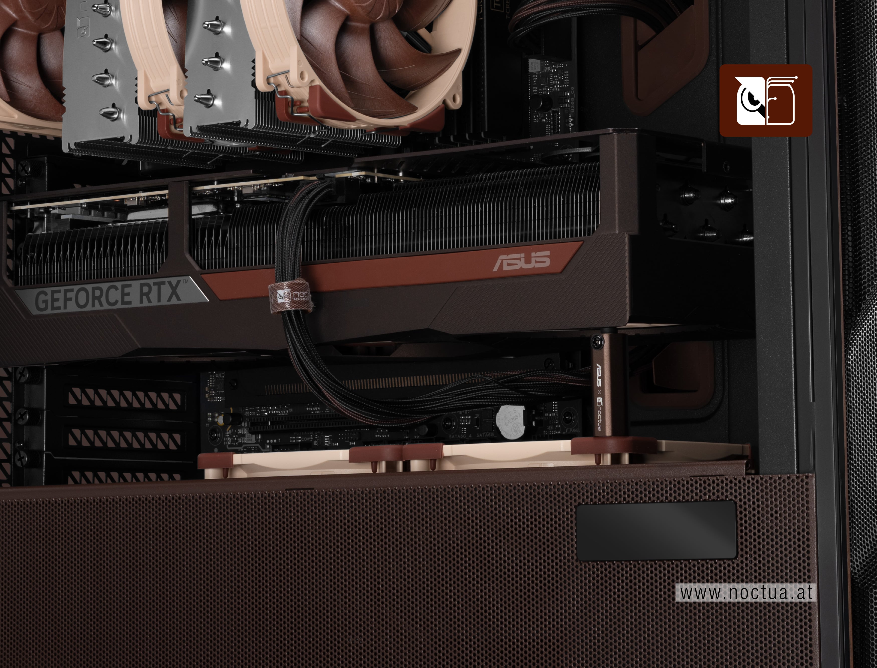 Closeup of the ASUS GeForce RTX 5080 Noctua Edition in the Antec Flux Pro Noctua Edition; the GPU stand is placed on the corner of the fan on top of the PSU shroud.