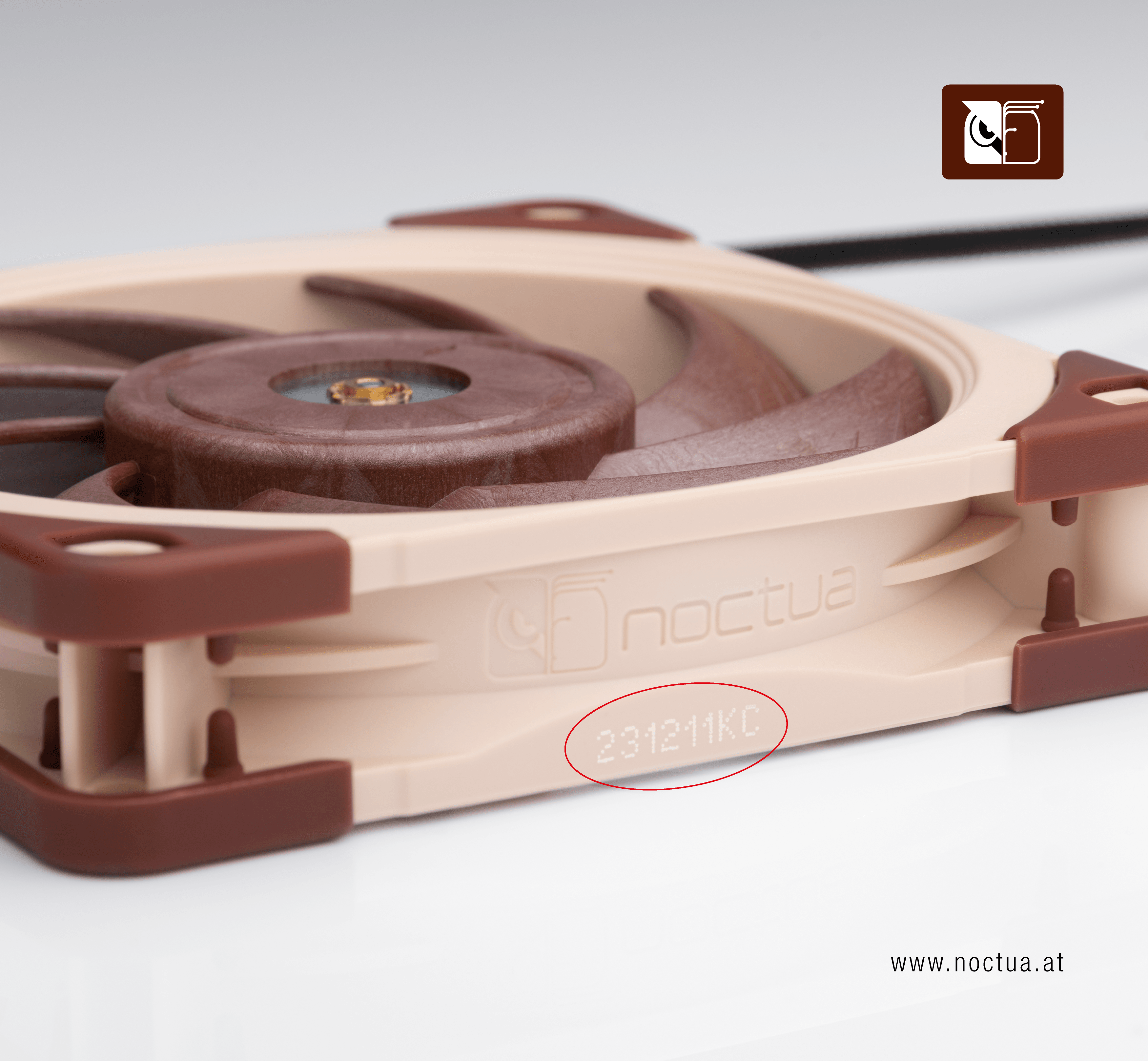 A fan frame from the side, there is a white number printed on it, 2311211KC, that is circled in red.