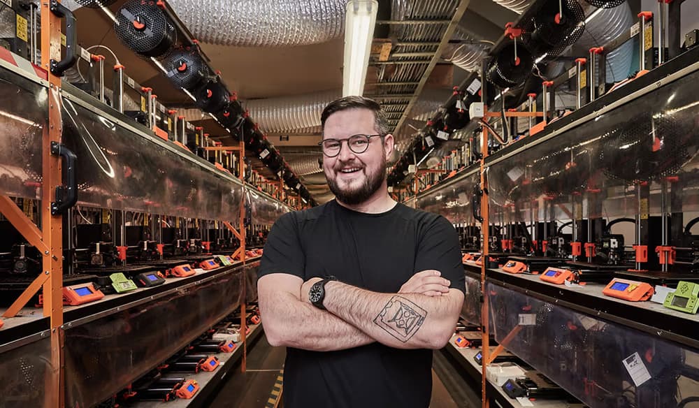 Josef Prusa in his 3D printer farm